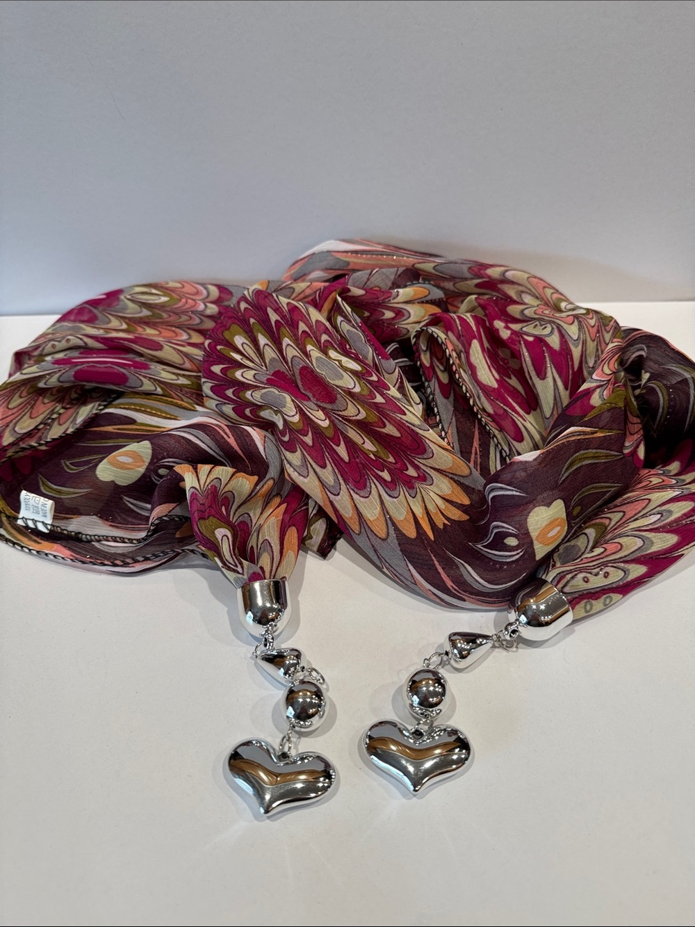 Floral scarf with gold metallic threads throughout with Silver Heart Charms